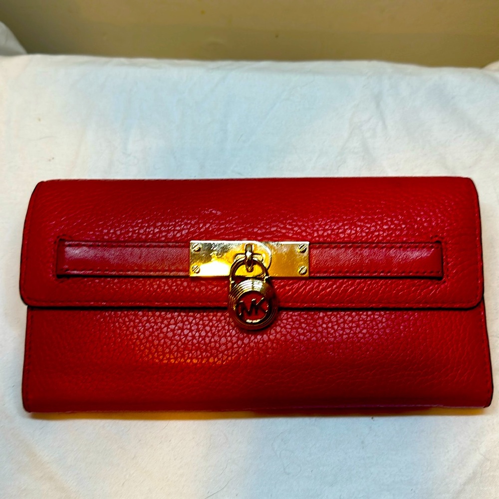 Red Michael Kors, leather wallet also have a matching purse